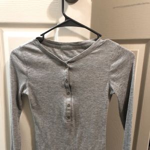 A dark grey fitted button up top